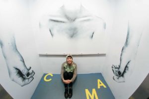 Kristina Hagman with work installed in elevator